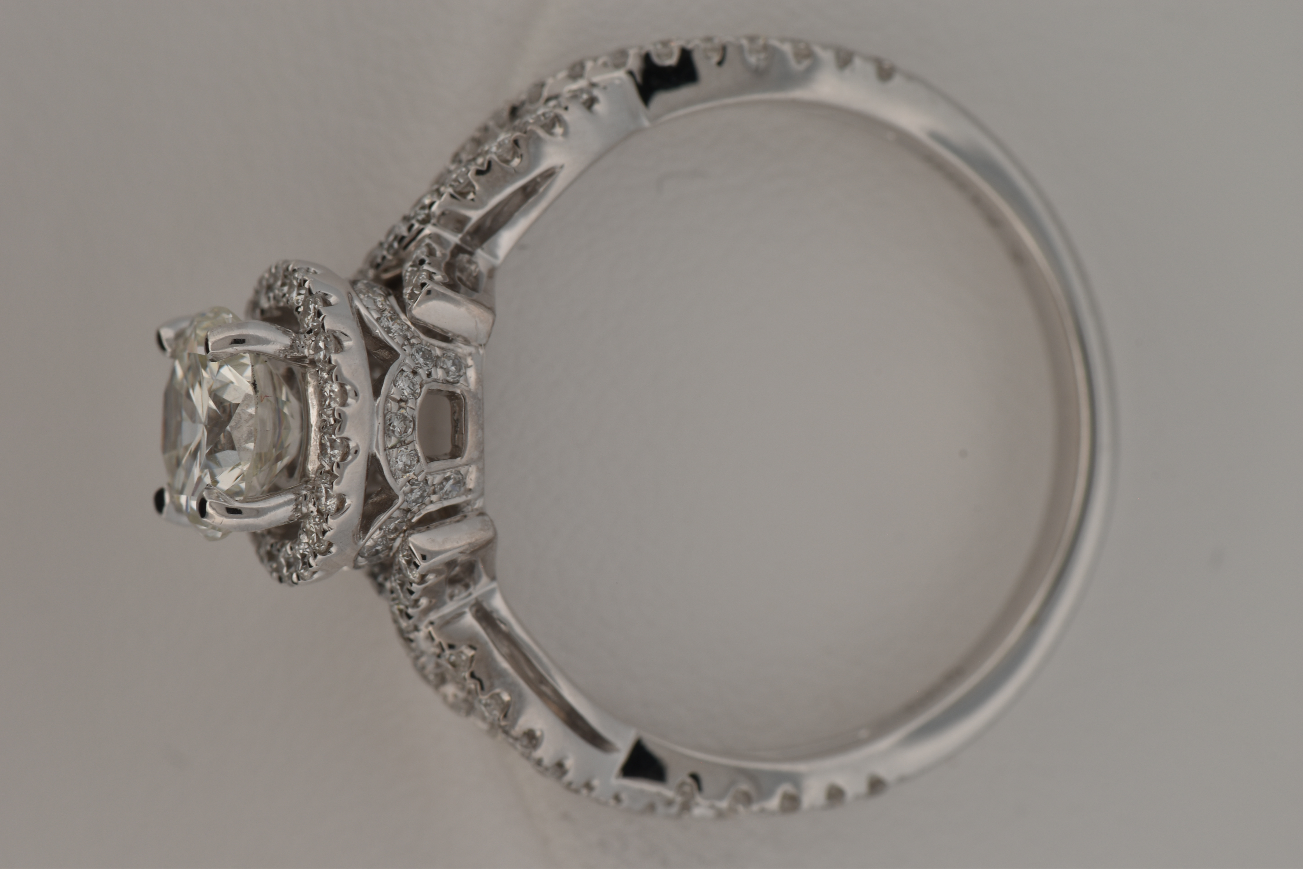 14K White Gold Diamond Ring with a 1.01 Carat Round Center Diamond, GIA Certified #17551661, VS2 Clarity, I Color and .63 Carat Total Weight in Round Cut Diamonds, SI1 Clarity, G-H Color.