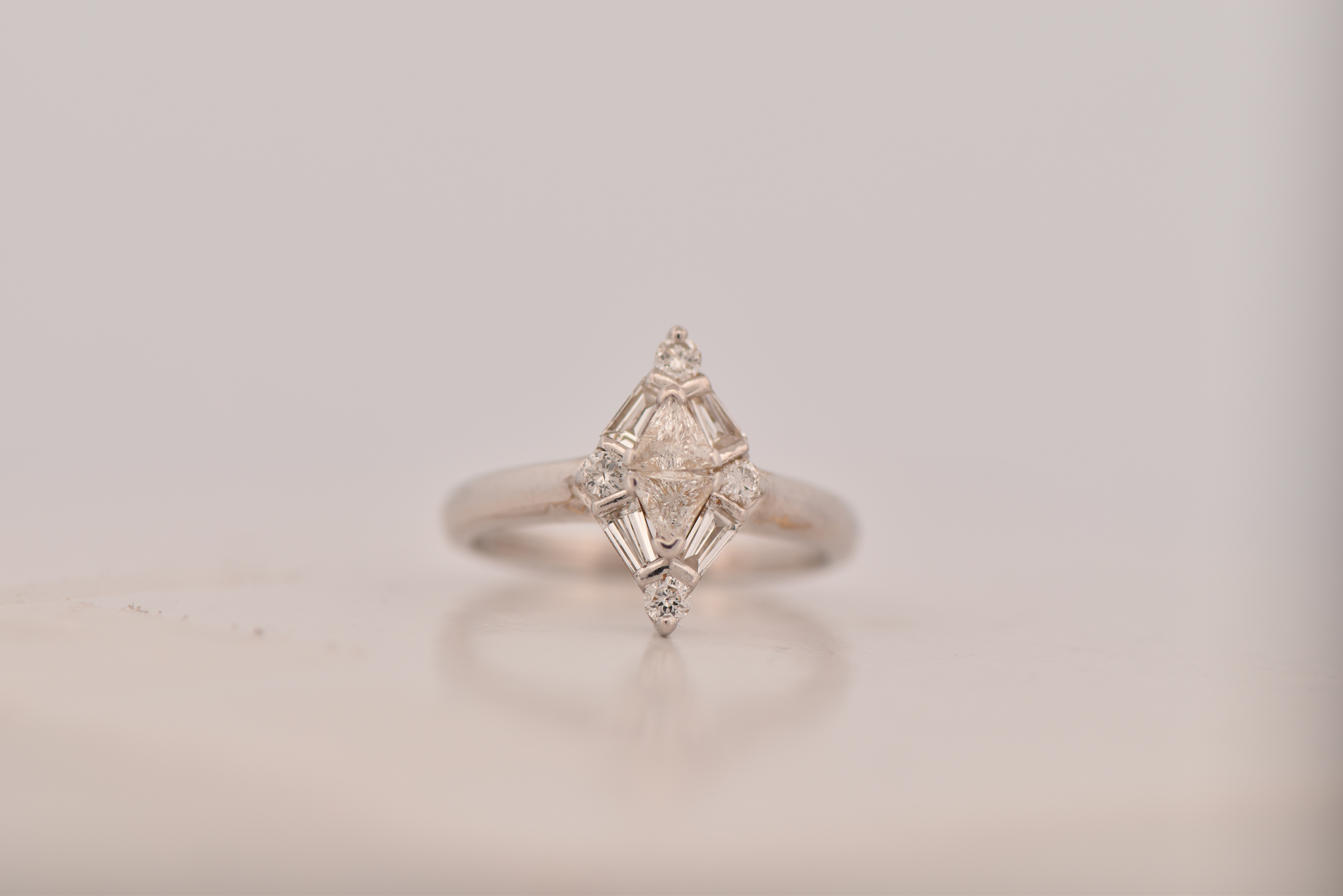 14K White Gold Diamond Estate Ring with Approximately .60 Carat Total Weight in Round, Baguette and Trillion Diamonds, SI Clarity, I-J Color  2.7 dwt, Ring Size 5