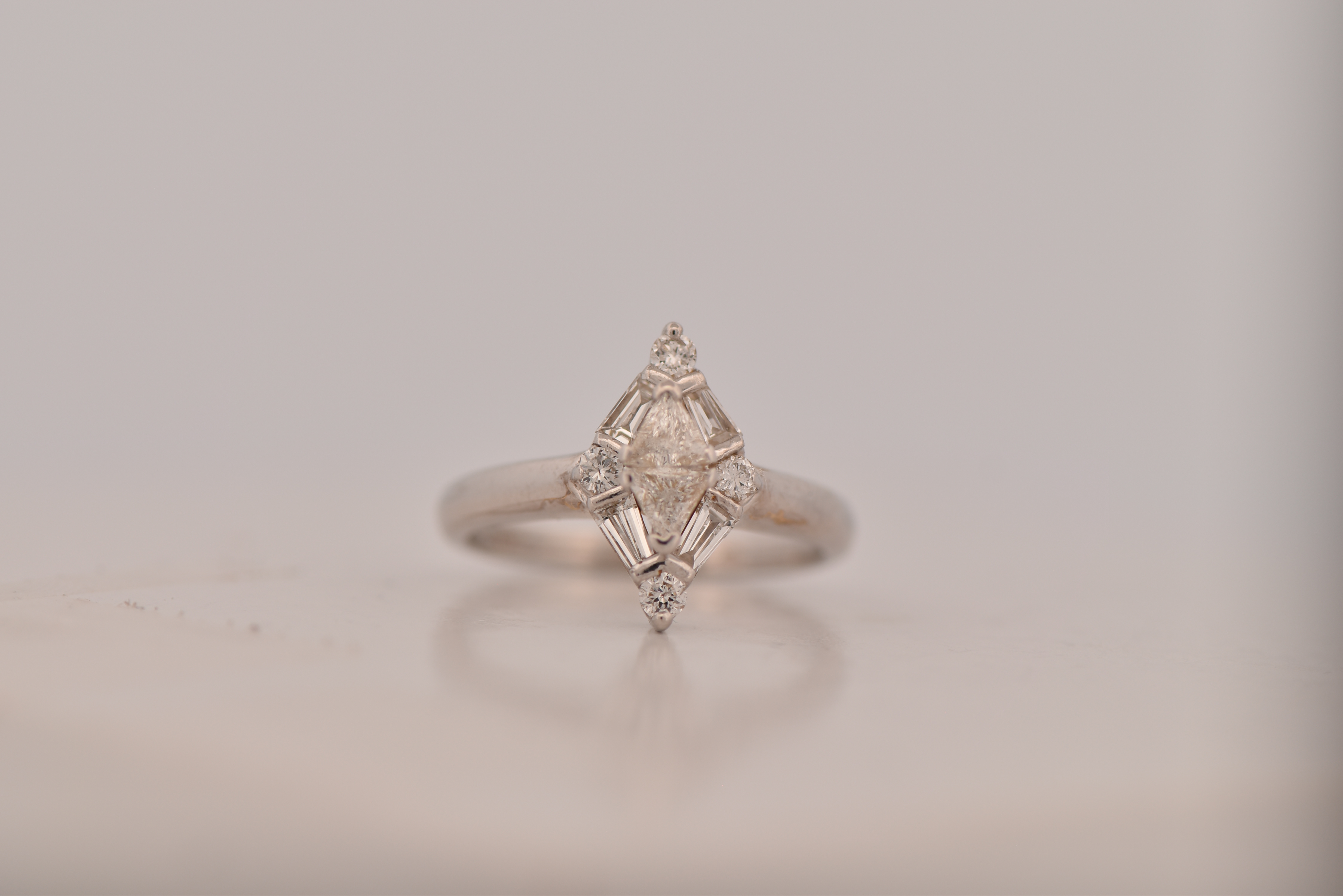 14K White Gold Diamond Estate Ring with Approximately .60 Carat Total Weight in Round, Baguette and Trillion Diamonds, SI Clarity, I-J Color  2.7 dwt, Ring Size 5