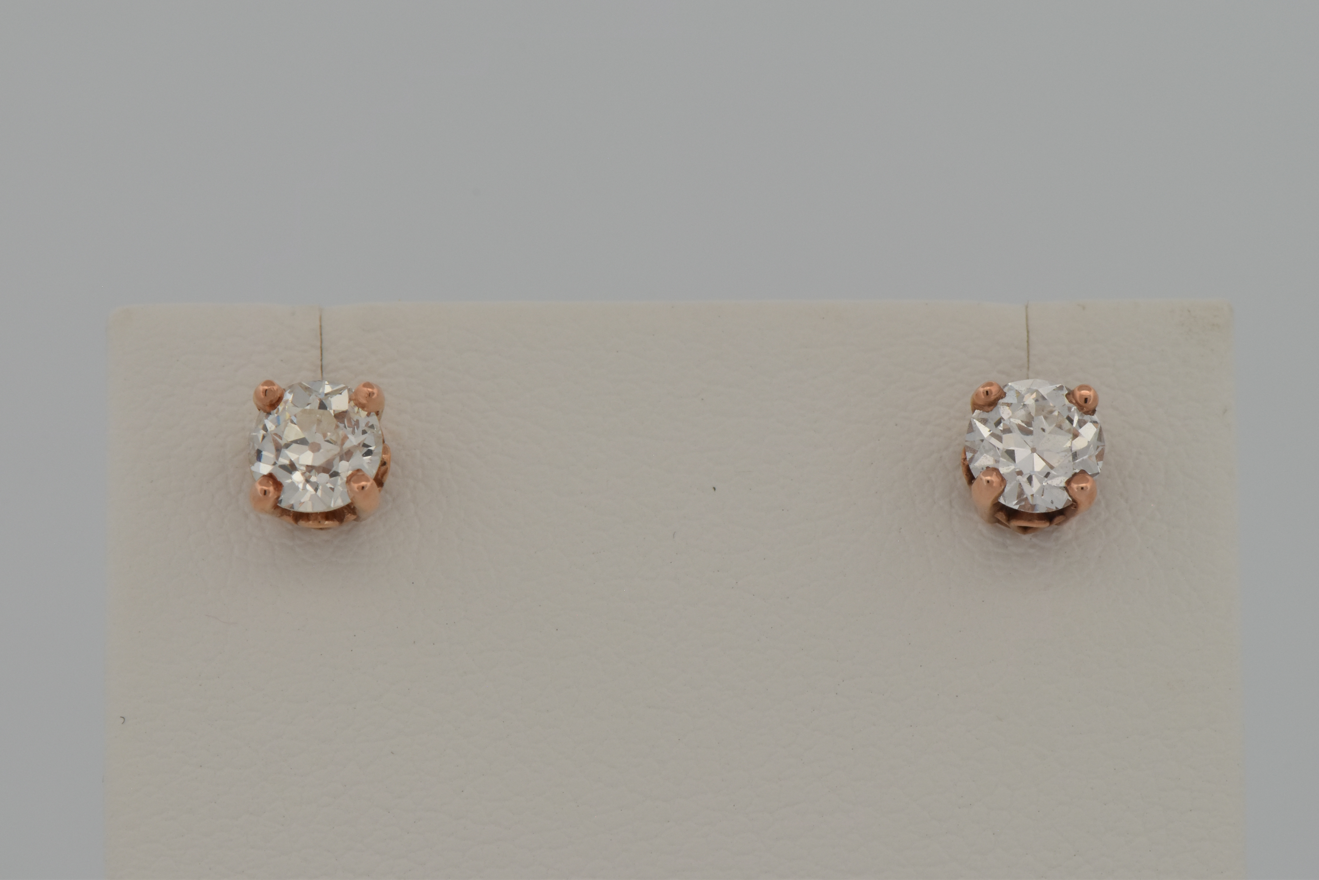 14K Rose Gold Diamond Earrings with a .47 Carat Old Cut Diamond, SI1-2 Quality, E-F Color. and a .48 Carat Old Cut Round Diamond, SI2 Quality, K Color "COE"