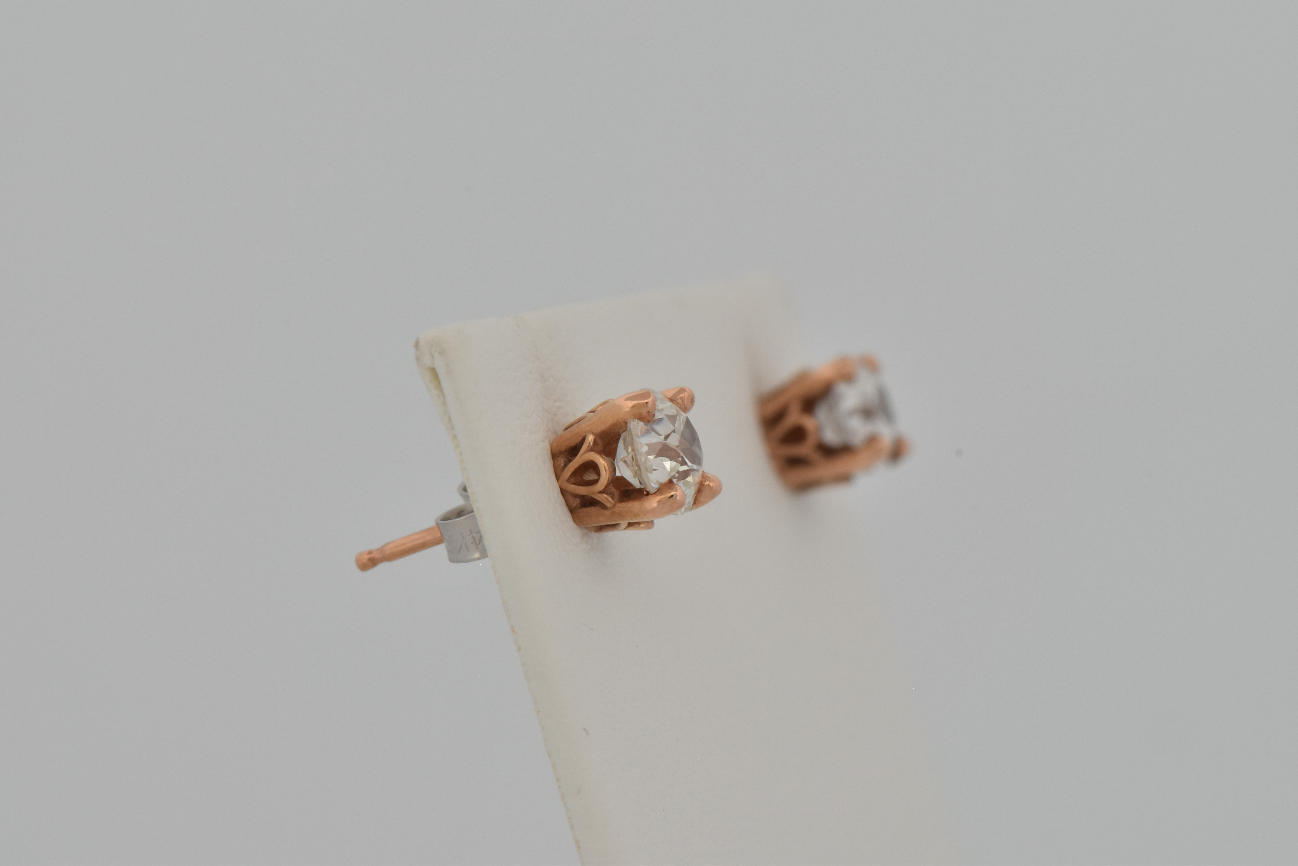 14K Rose Gold Diamond Earrings with a .47 Carat Old Cut Diamond, SI1-2 Quality, E-F Color. and a .48 Carat Old Cut Round Diamond, SI2 Quality, K Color "COE"