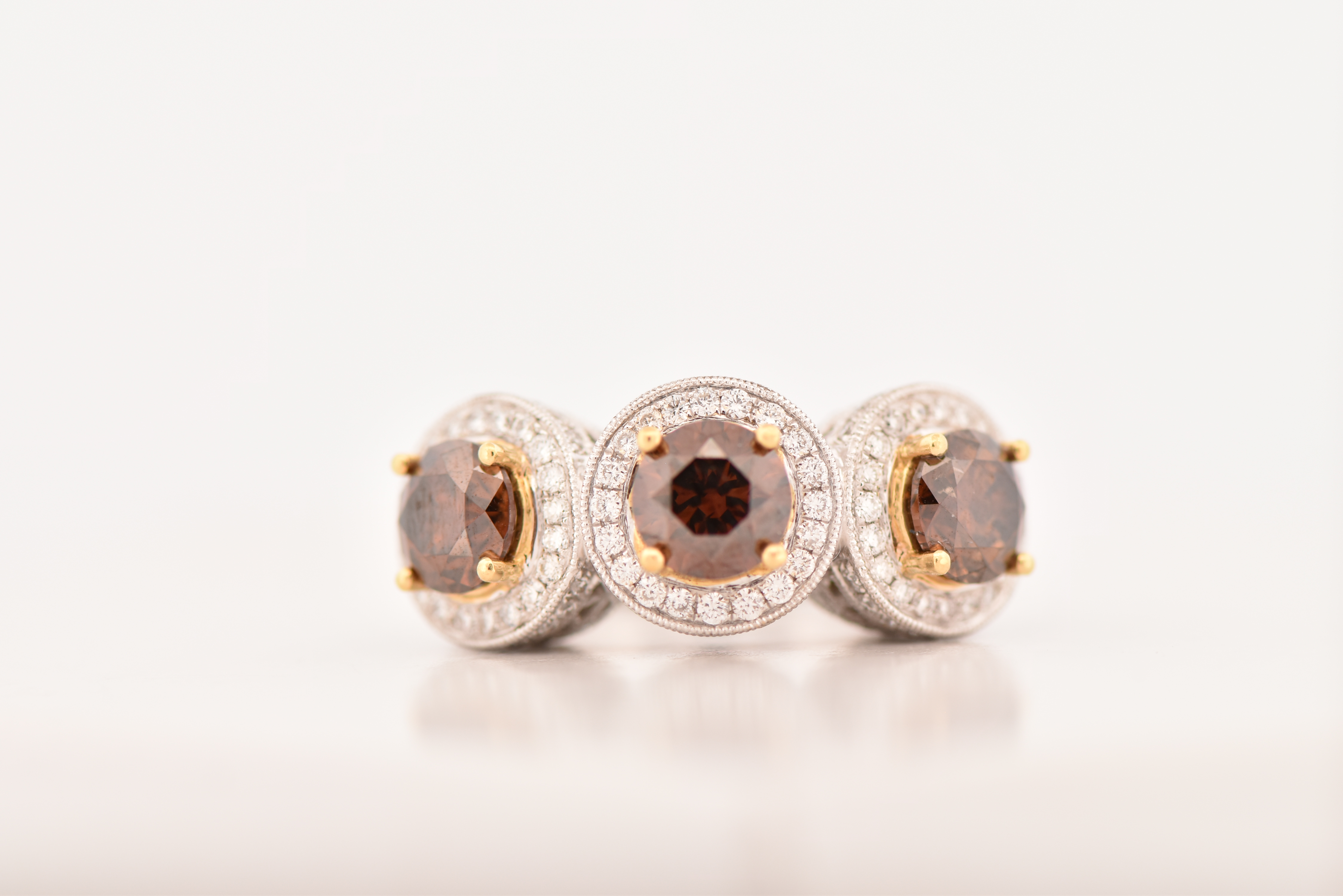18K White Gold LeVian Diamond Ring with Three Round Chocolate Diamonds, Totaling 3.03 cttw, I1 clarity and 1.36 cttw of Brilliant Cut Round Diamonds, SI Clarity, G-H Color. Ring size 7.25, 6.4 dwt.