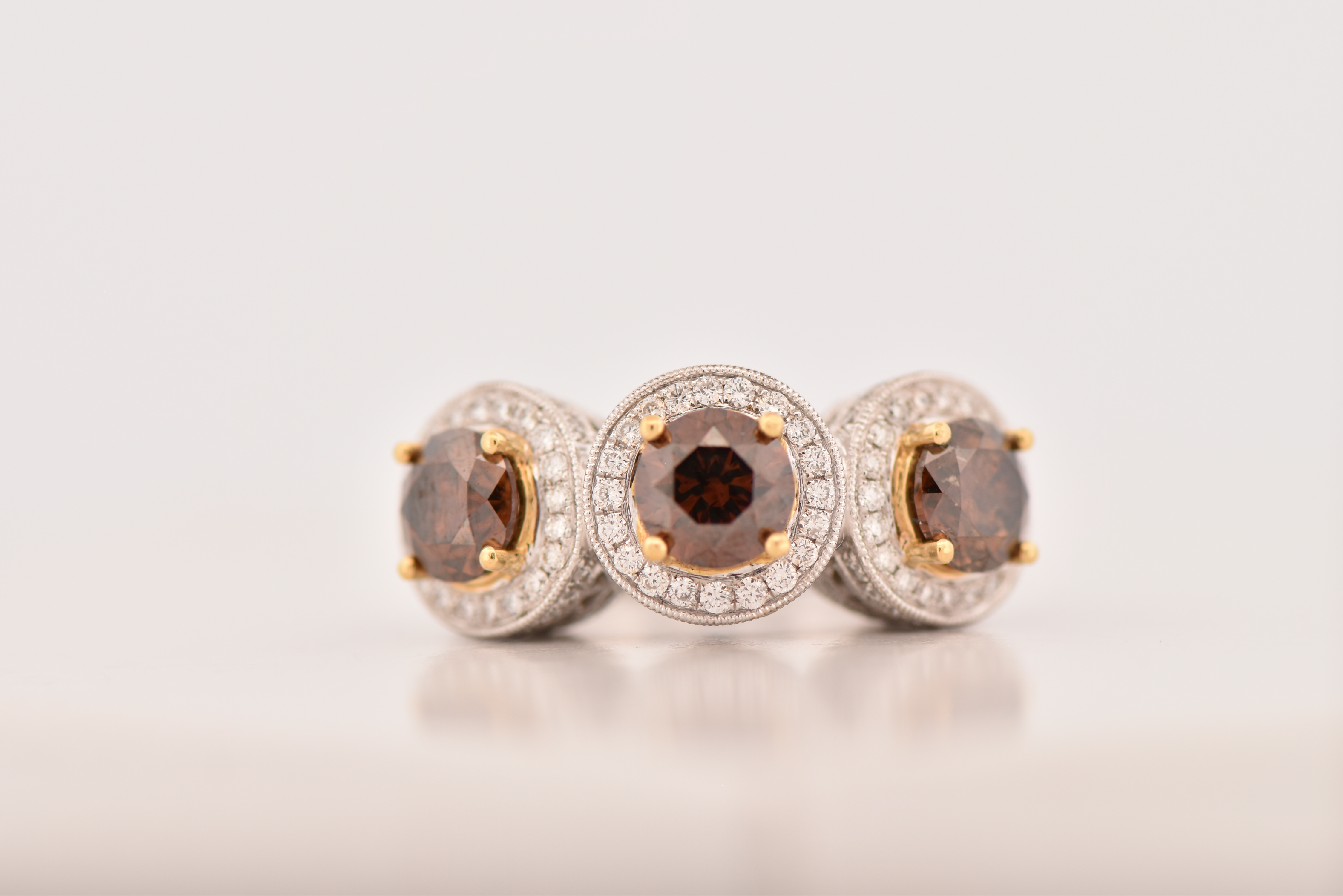 18K White Gold LeVian Diamond Ring with Three Round Chocolate Diamonds, Totaling 3.03 cttw, I1 clarity and 1.36 cttw of Brilliant Cut Round Diamonds, SI Clarity, G-H Color. Ring size 7.25, 6.4 dwt.