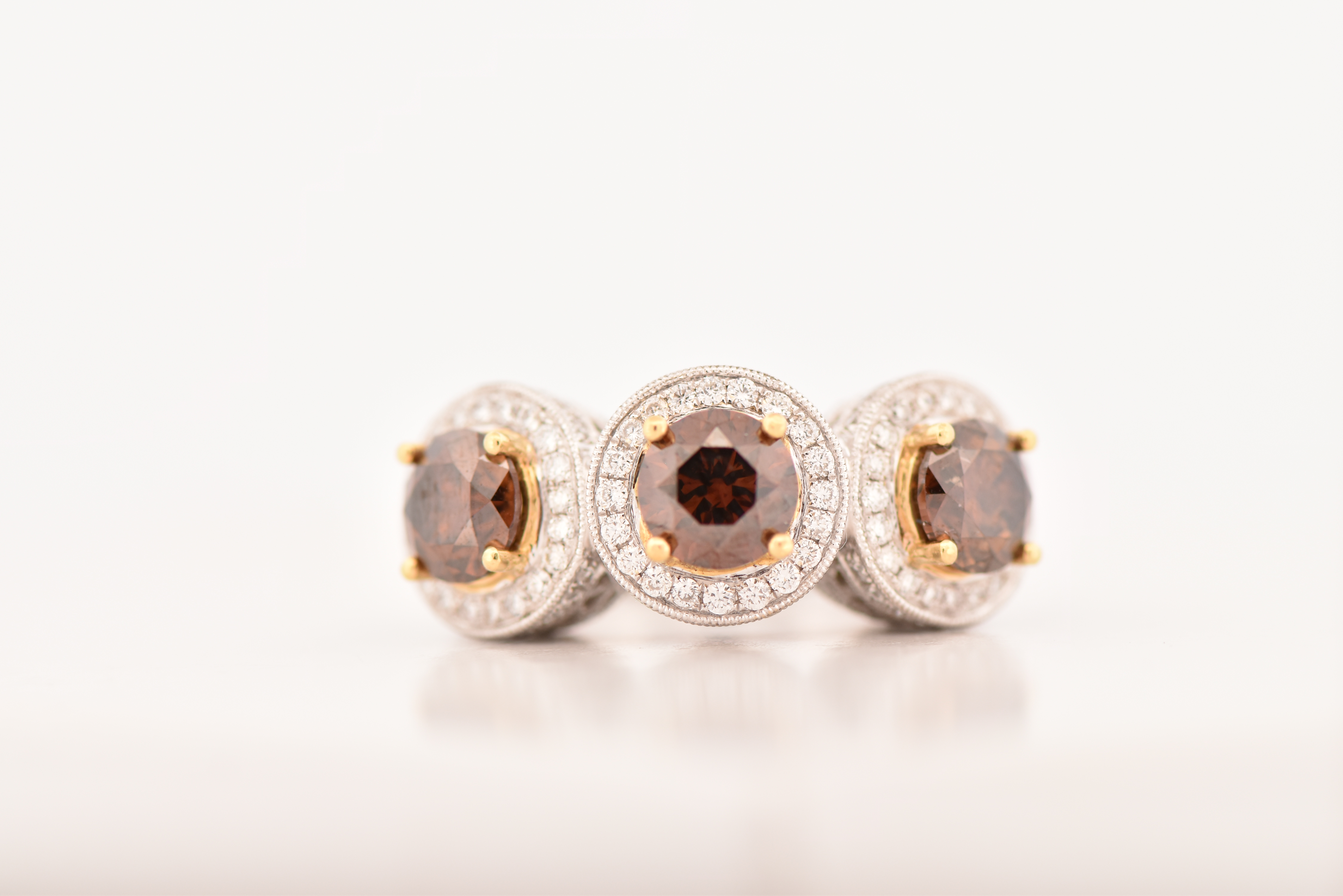 18K White Gold LeVian Diamond Ring with Three Round Chocolate Diamonds, Totaling 3.03 cttw, I1 clarity and 1.36 cttw of Brilliant Cut Round Diamonds, SI Clarity, G-H Color. Ring size 7.25, 6.4 dwt.