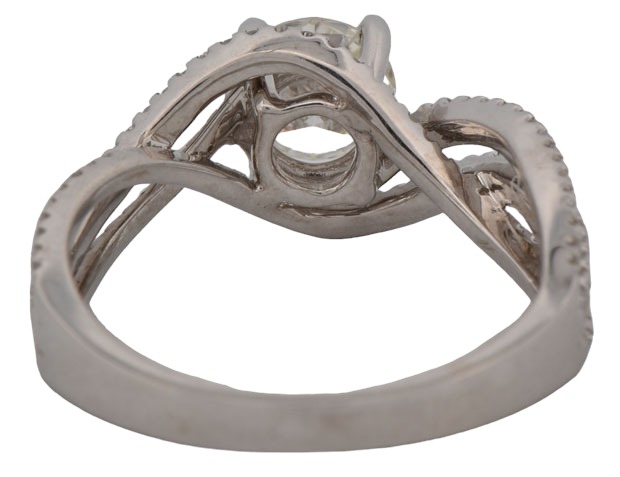 14K White Gold Estate Diamond Ring with a .80 Carat Round Brilliant Diamond, VS1 Clarity, J Color and Approximately .50 Carat Total Weight in Side Diamonds.