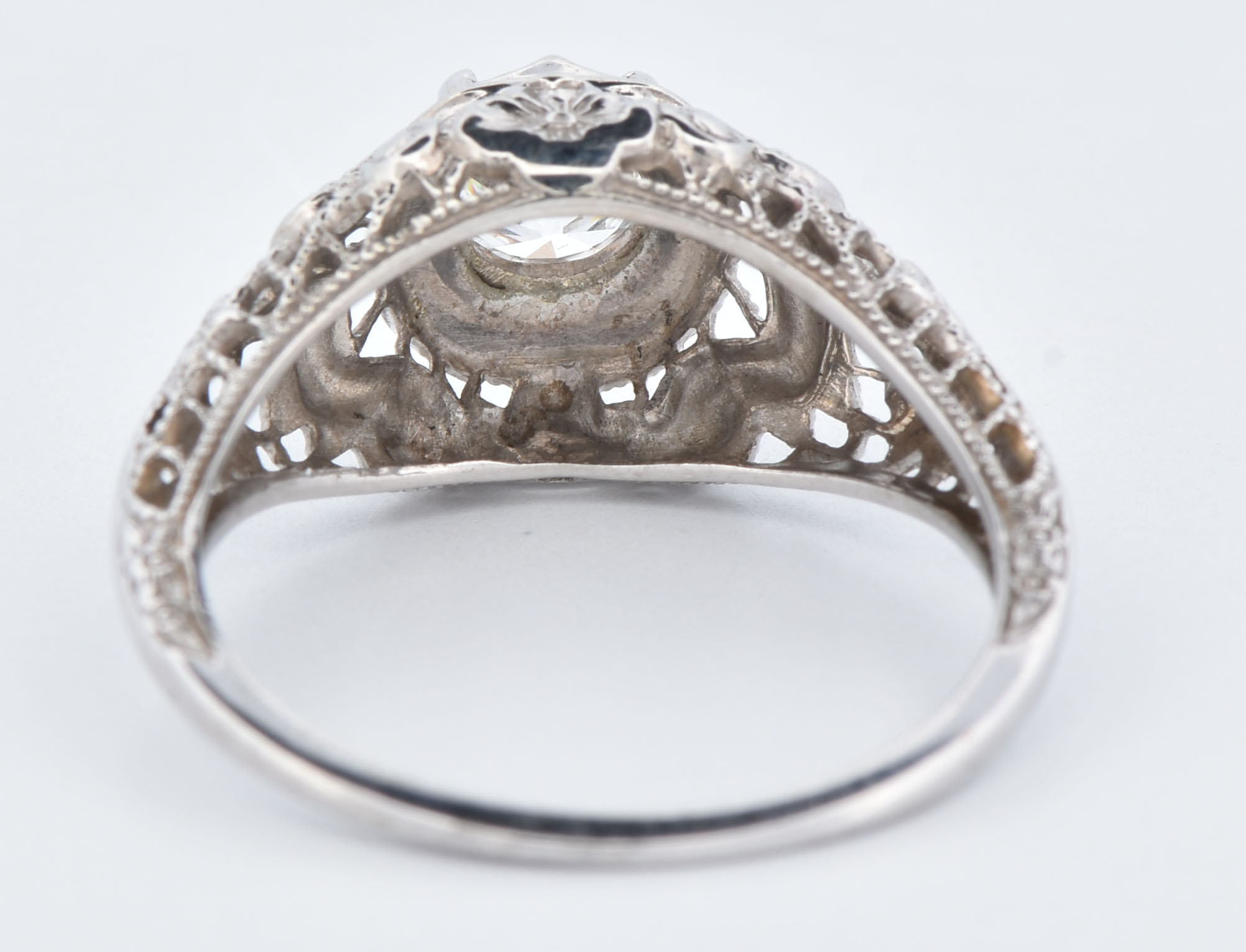 18K White Gold Estate Diamond Ring with a .49 Carat Round Brilliant Cut Center Diamond, VS2 Clarity, H Color Set in a Mounting with Floral Designs and Open Wire-Work. Ring size 5.5,1.6 dwt.