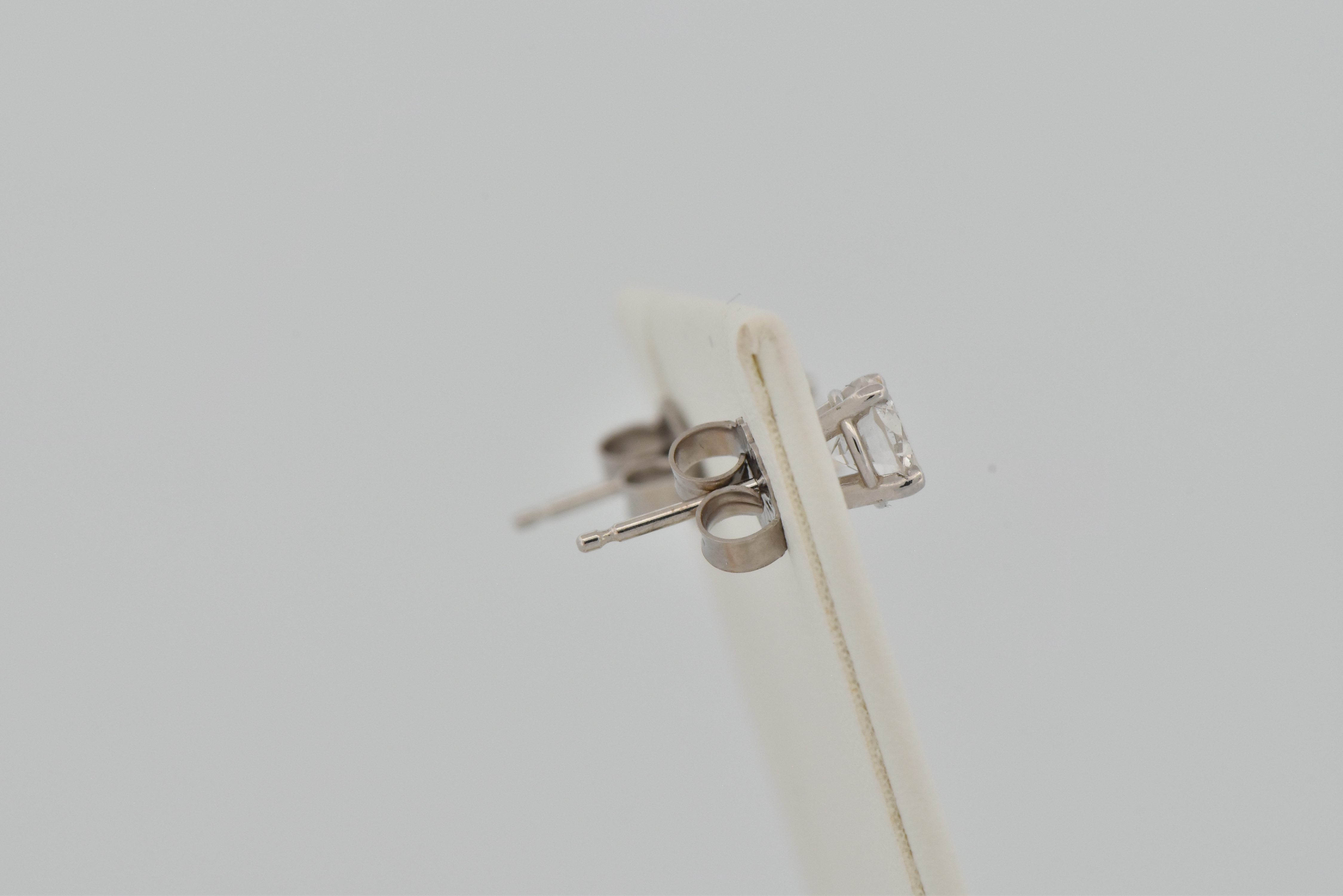 14K White Gold Diamond Stud Earrings with a .48 Carat Round Cut Diamond, SI2 Clarity, H Color, GIA # 6217821536 and a .46 Carat Round Cut Diamond, I1 Clarity, H Color, GIA # 2215821540.