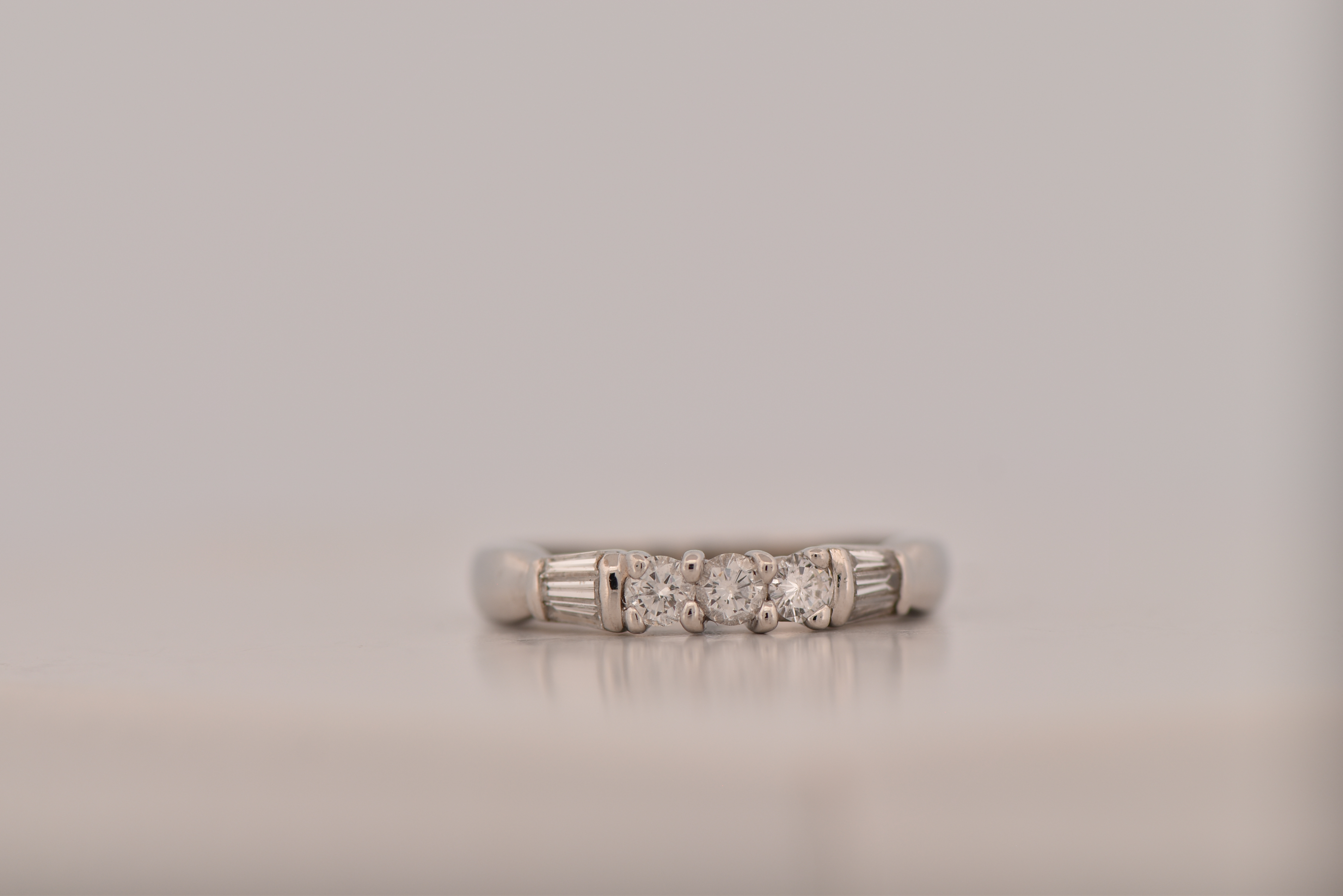 Platinum Estate Diamond Band with Approximately .60 Carat Total Weight in Round and Baguette Cut Diamonds, SI2 Clarity, I-J Color. 4.2 dwt.