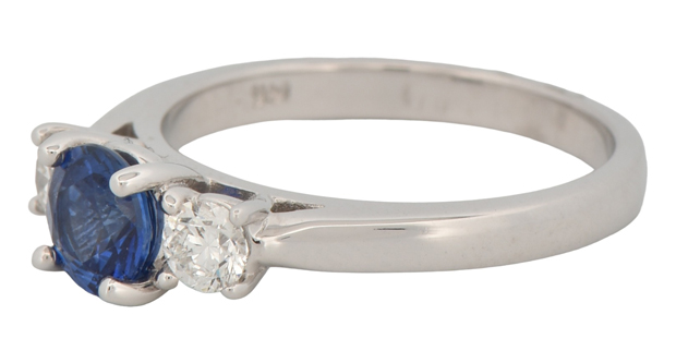 14K White Gold Three Stone Ring with a .85 Carat Round Sapphire Center Stone and Two Side Diamonds Totaling .35 Carat Total Weight in Round Cut Diamonds, SI1 Clarity, G-H Color.