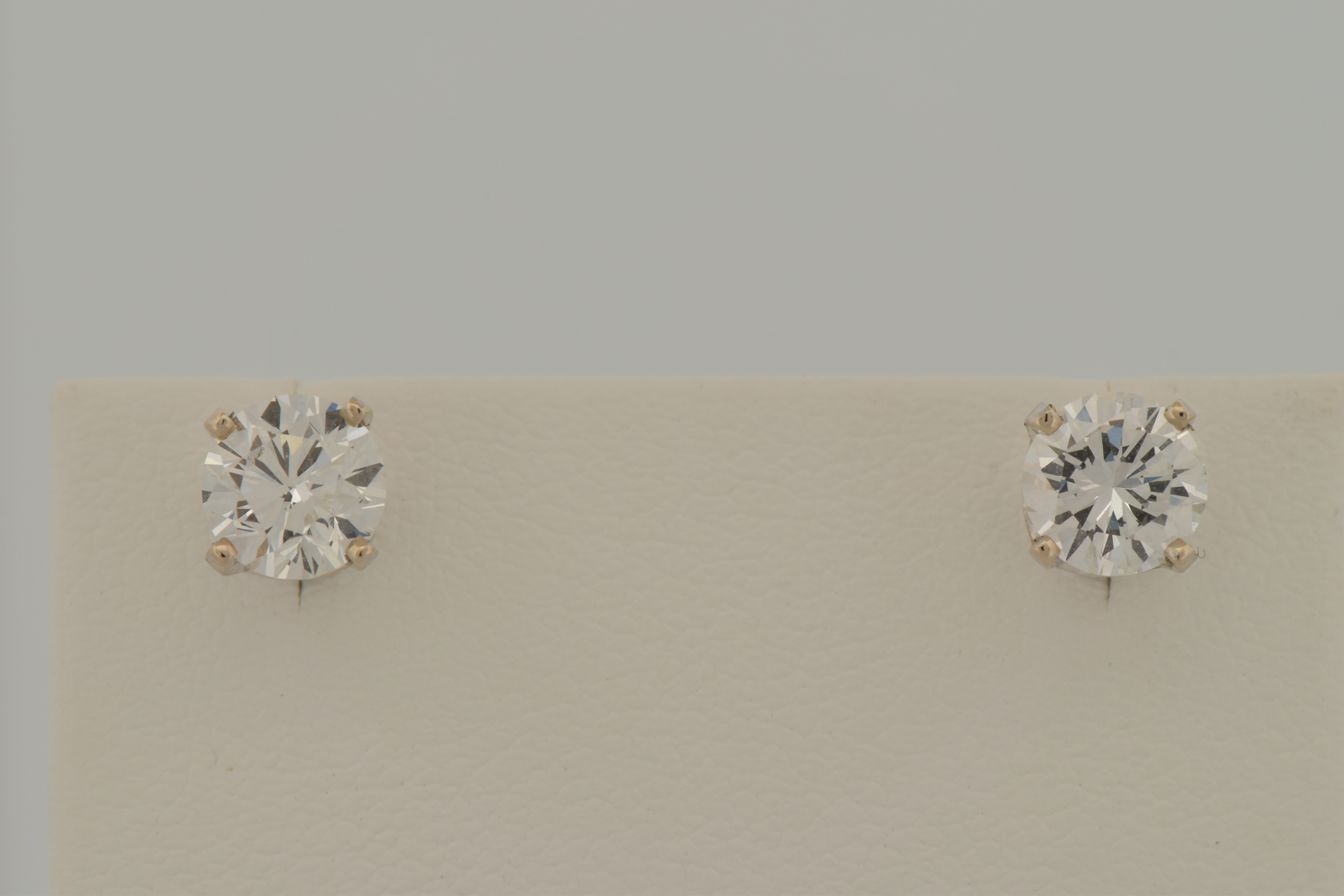 14K White Gold Diamond Stud Earrings with a .68 Carat Round Brilliant Diamond, VVS2 Clarity, G Color GIA #6223575732 and .76 Carat Round Brilliant, VVS1 Clarity, H Color GIA #2223670320