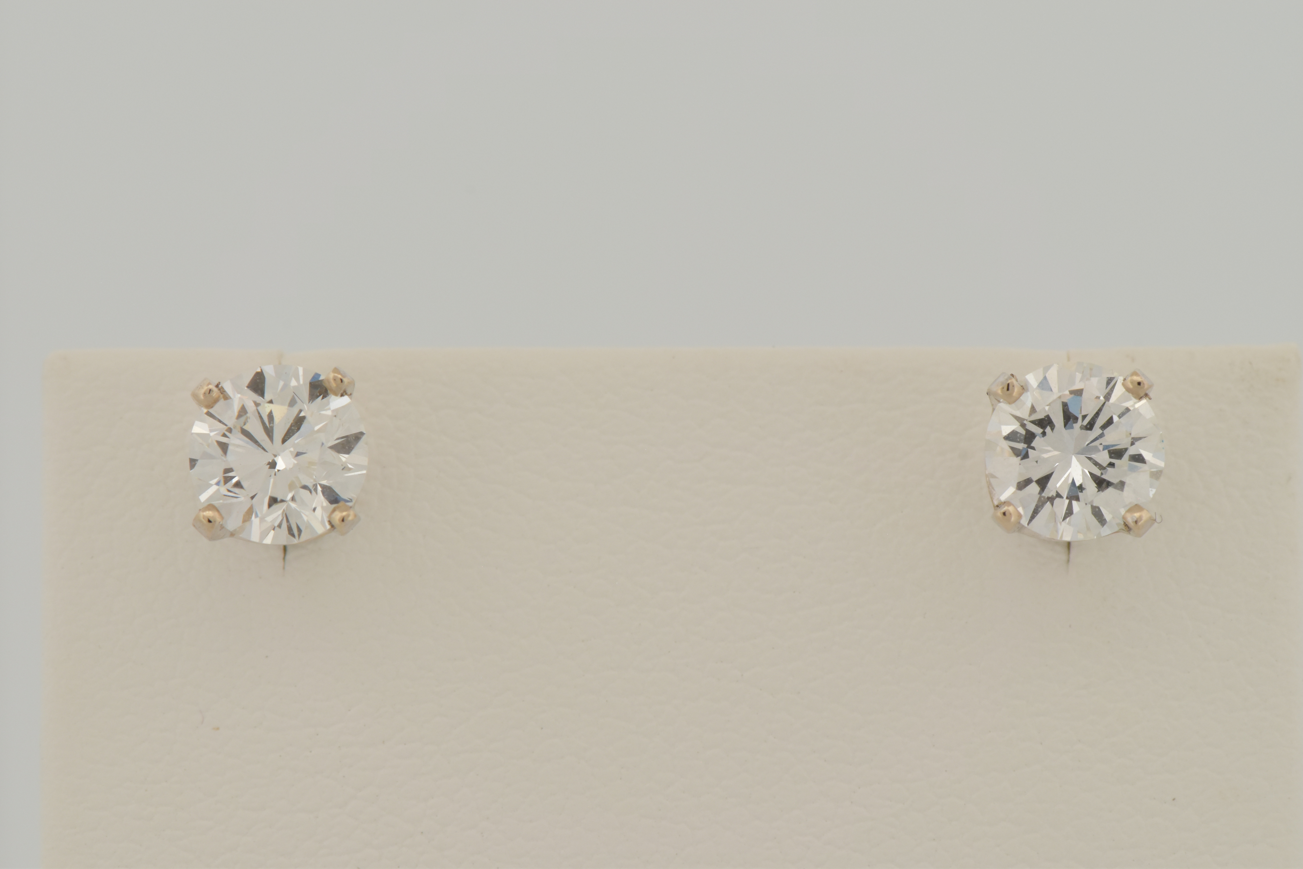 14K White Gold Diamond Stud Earrings with a .68 Carat Round Brilliant Diamond, VVS2 Clarity, G Color GIA #6223575732 and .76 Carat Round Brilliant, VVS1 Clarity, H Color GIA #2223670320
