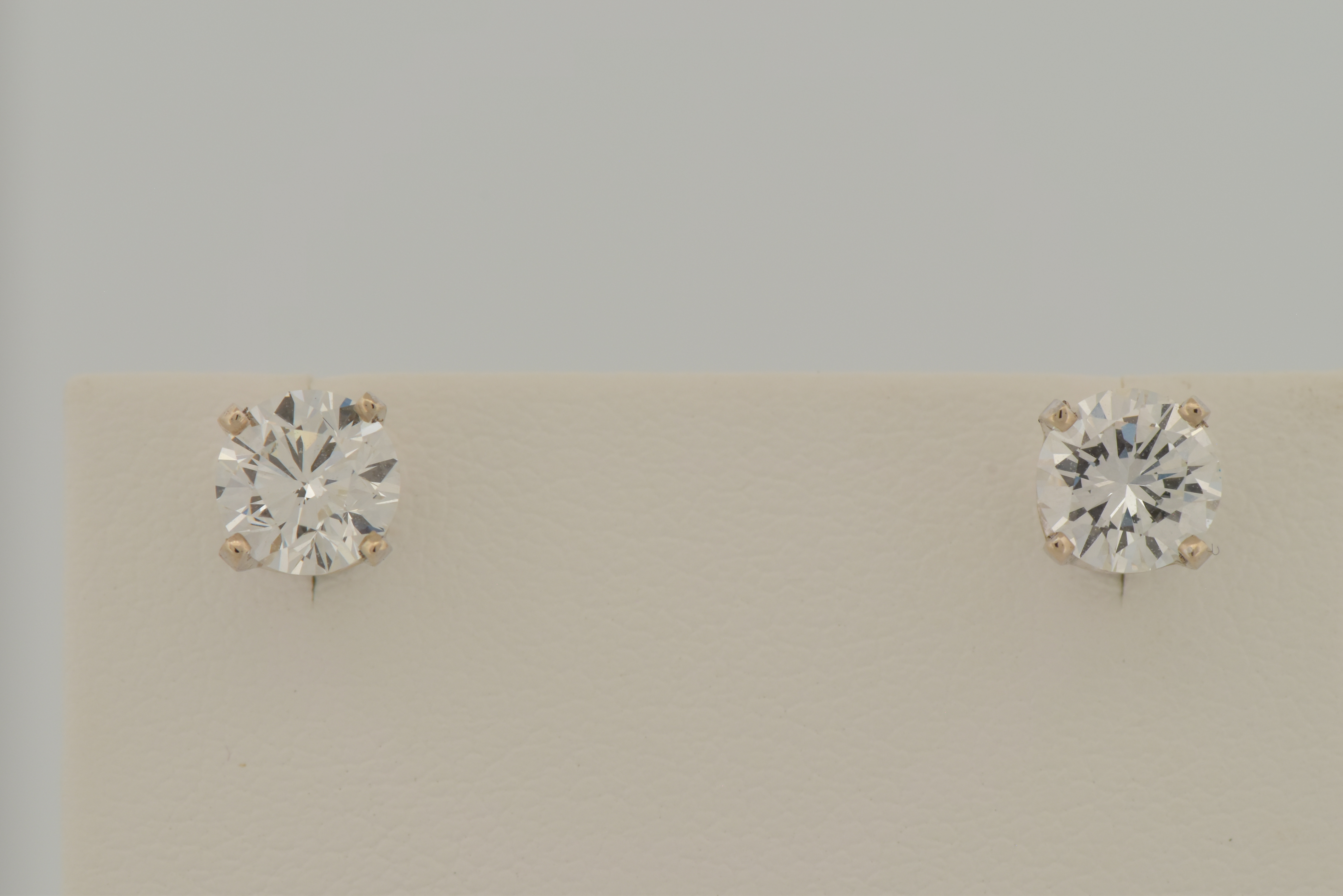 14K White Gold Diamond Stud Earrings with a .68 Carat Round Brilliant Diamond, VVS2 Clarity, G Color GIA #6223575732 and .76 Carat Round Brilliant, VVS1 Clarity, H Color GIA #2223670320