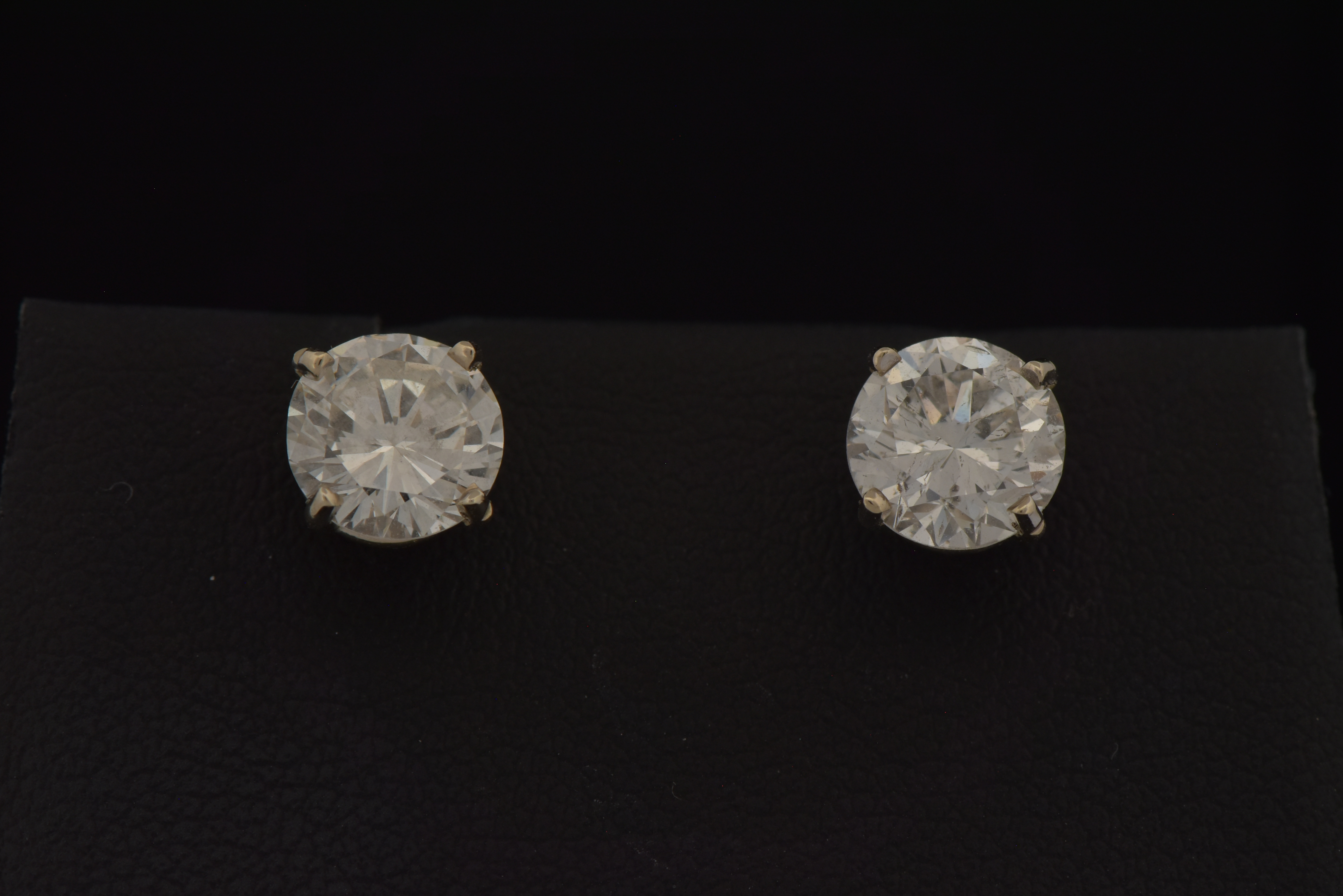 14K White Gold Diamond Stud Earrings with a 1.25 Carat Round Brilliant I1 Clarity, G Color GIA #2225850512 and a 1.09 Carat Round Brilliant, I1 Clarity , H Color GIA #6227646142