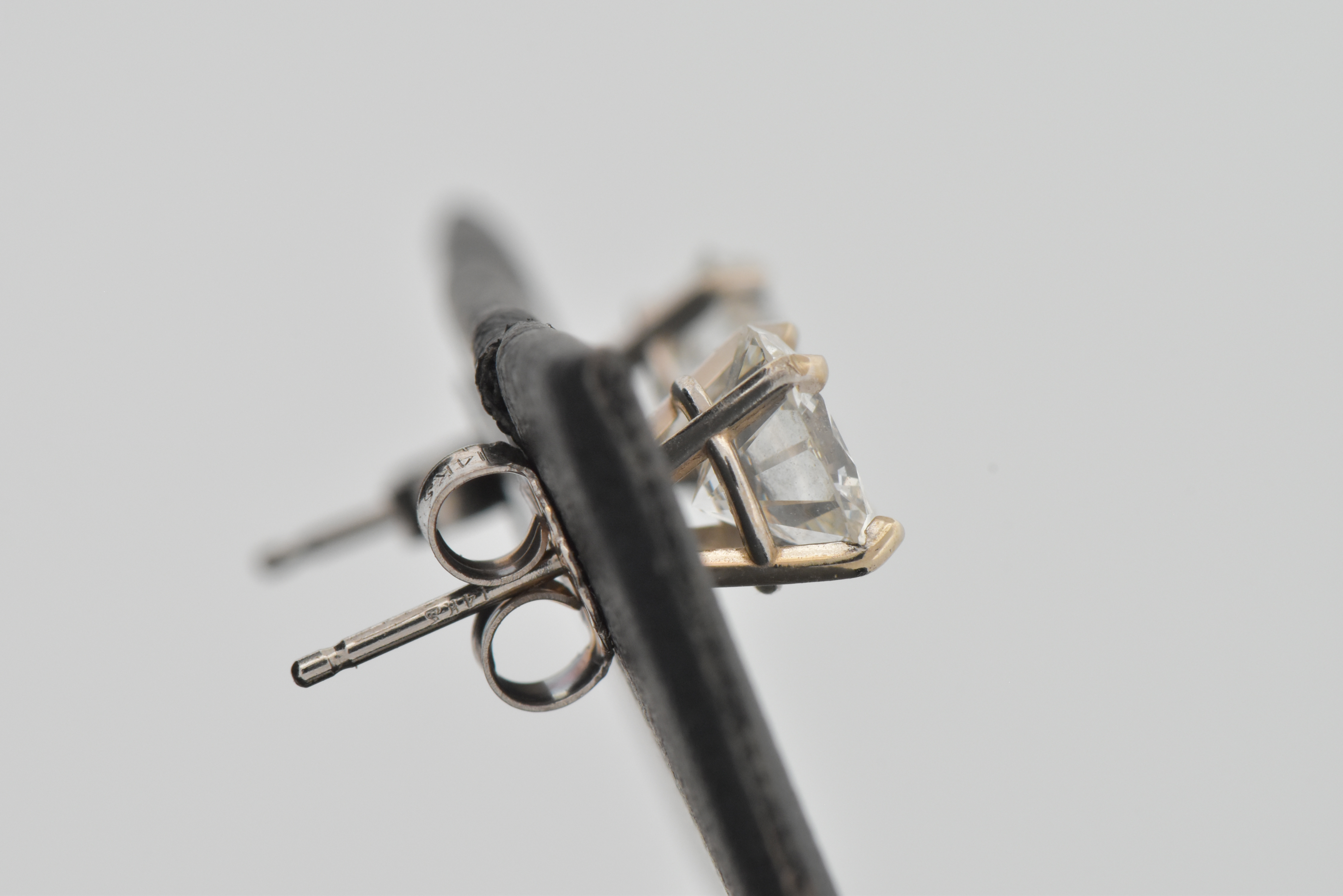 14K White Gold Diamond Stud Earrings with a 1.25 Carat Round Brilliant I1 Clarity, G Color GIA #2225850512 and a 1.09 Carat Round Brilliant, I1 Clarity , H Color GIA #6227646142
