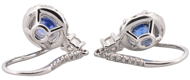 14K White Gold Sapphire and Diamond Dangle Earrings with 1.21 Carat Total Weight in Round Cut Sapphires and .53 Carat Total Weight in Round Cut Diamonds.