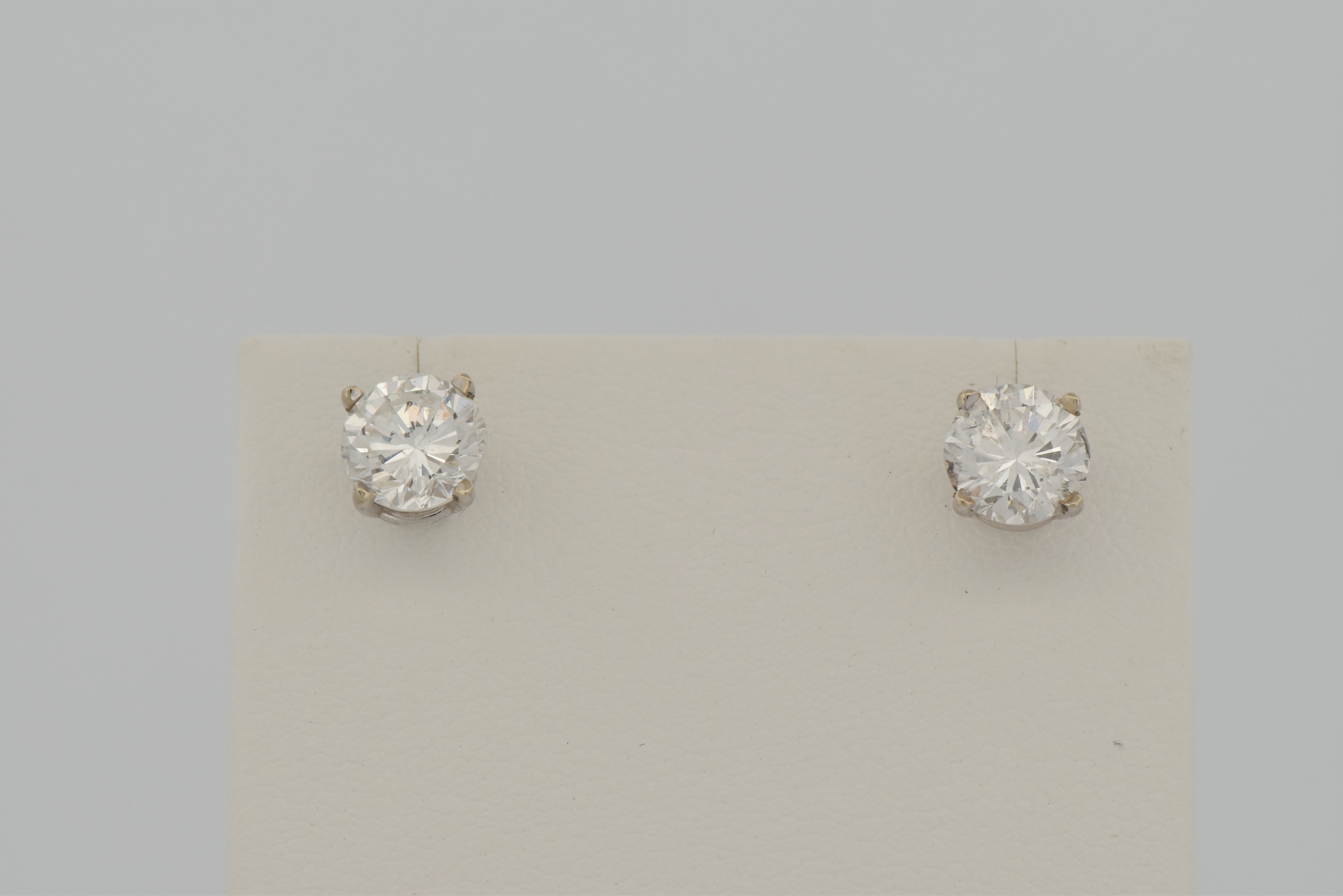 14K Diamond Stud Earrings with a .93 Carat Round Brilliant, I1 Clarity, F Color GIA #5222646123 and a .94 Carat Round Brilliant, I1 Clarity, G Color GIA #2225470606