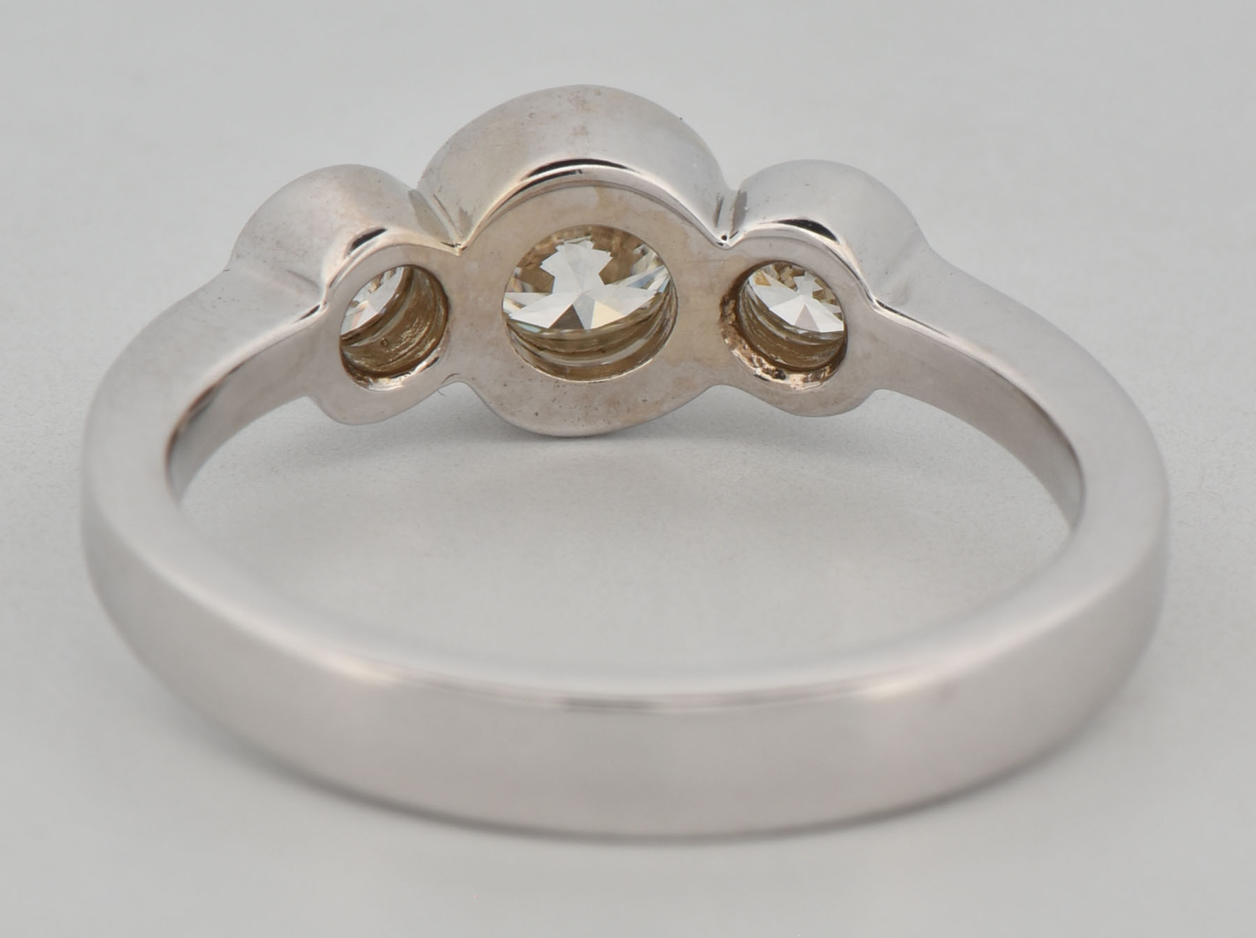 18K White Gold Estate Three Stone Diamond Ring with an Approximate .50 Carat Round Cut Diamond and Two Side Round Diamonds Totaling Approximately .15 Carat Total Weight, VS Clarity, I-J Color. 2.7 dwt