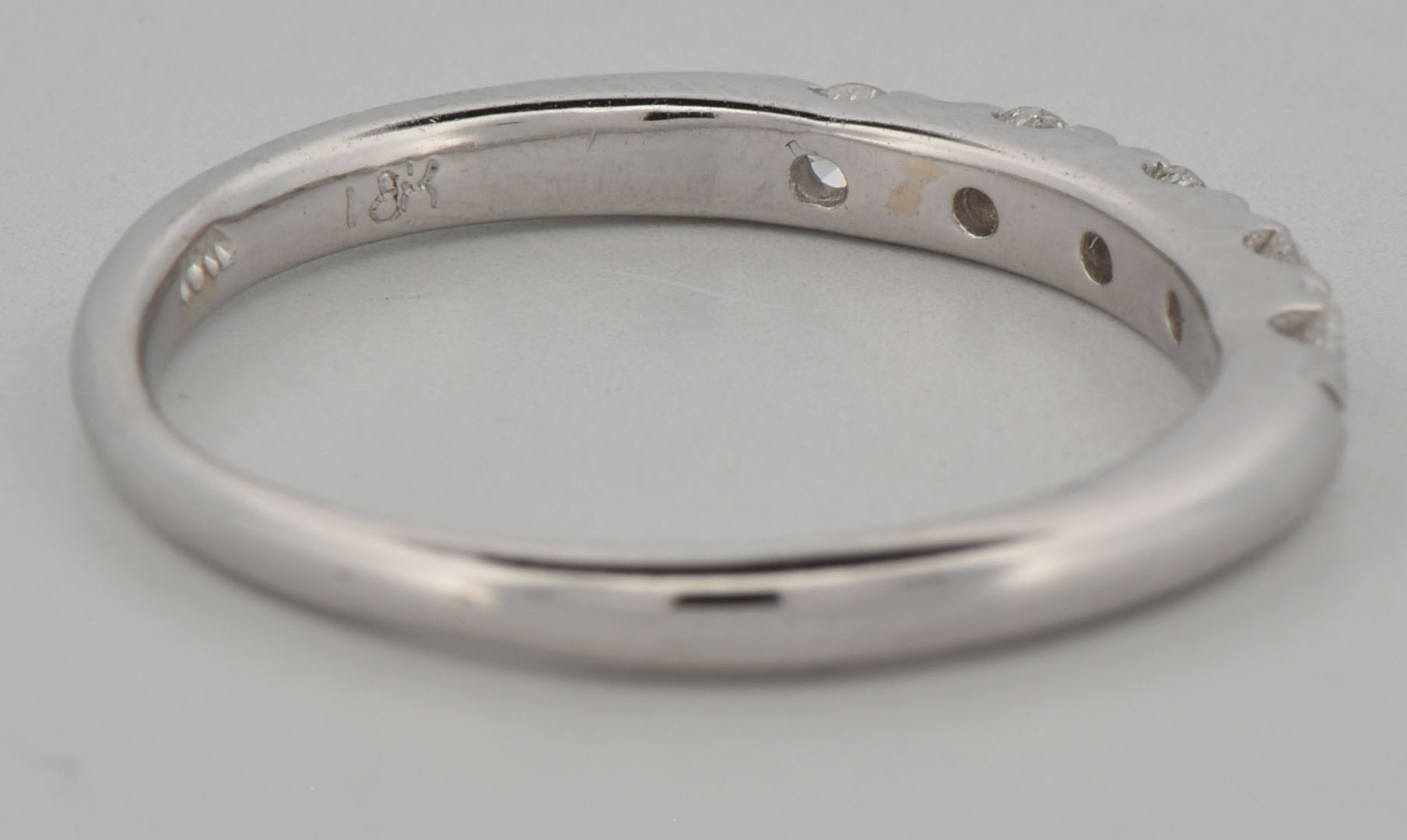 18K White Gold Estate Diamond Band with Approximately .20 Carat Total Weight in Round Cut Diamonds, SI1 Clarity, H-I Color. Finger Size 7, 1.7 dwt.