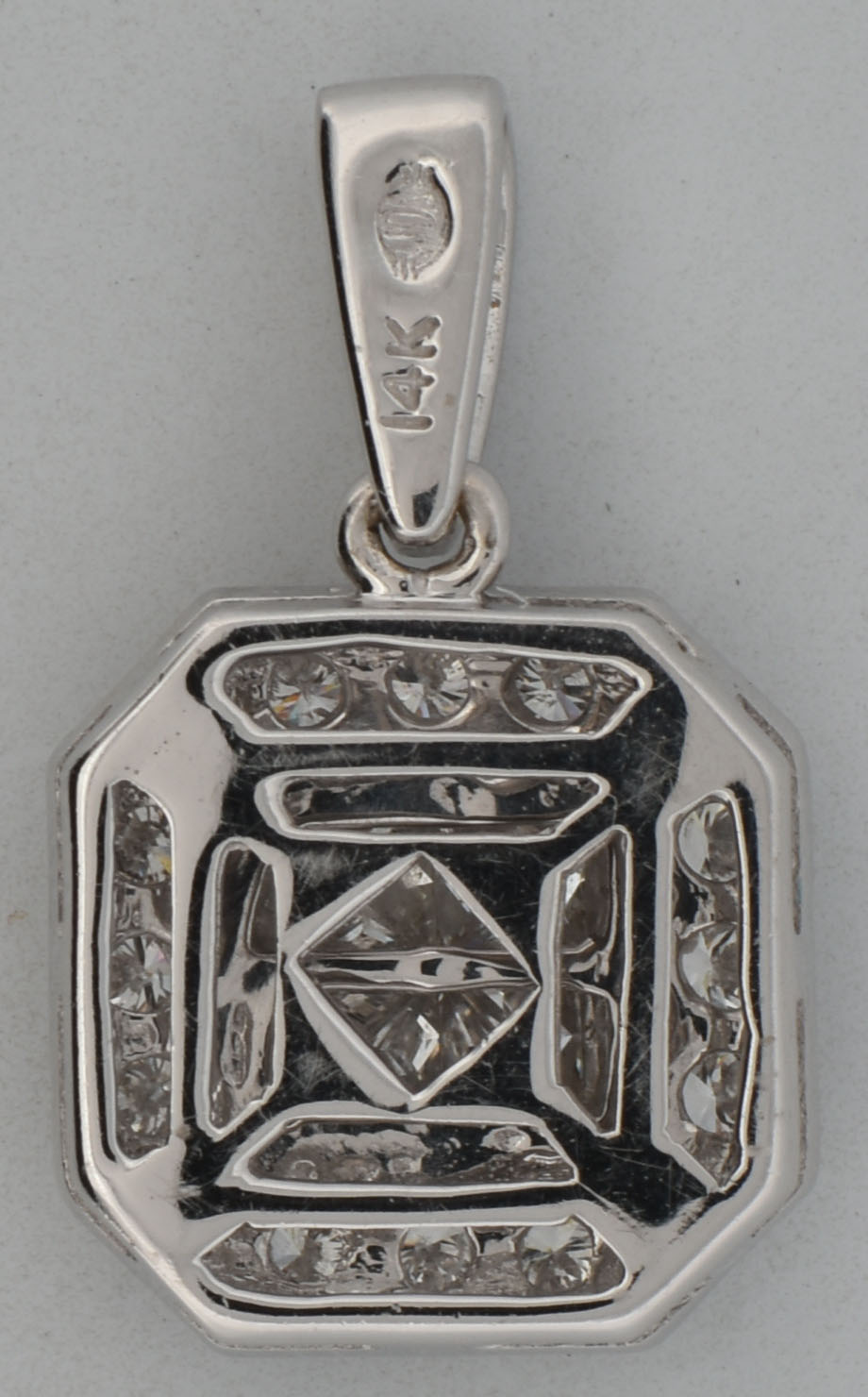14K White Gold Diamond Pendant with Approximately .60 Carat Total Weight in Round and Princess Cut Diamonds, SI Clarity, G-H Color