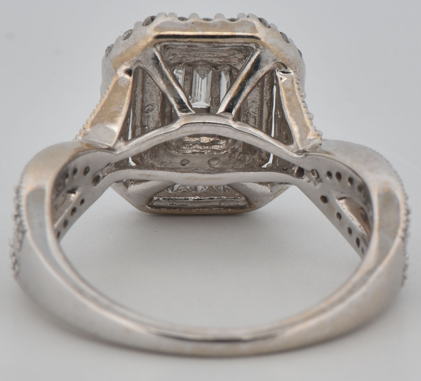 14K White Gold Estate Diamond Ring with Approximately 1.00 Carat Total Weight in Round and Baguette Cut Diamonds, SI1 Clarity, H-I Color. Finger Size 7.25, 4.0 dwt.