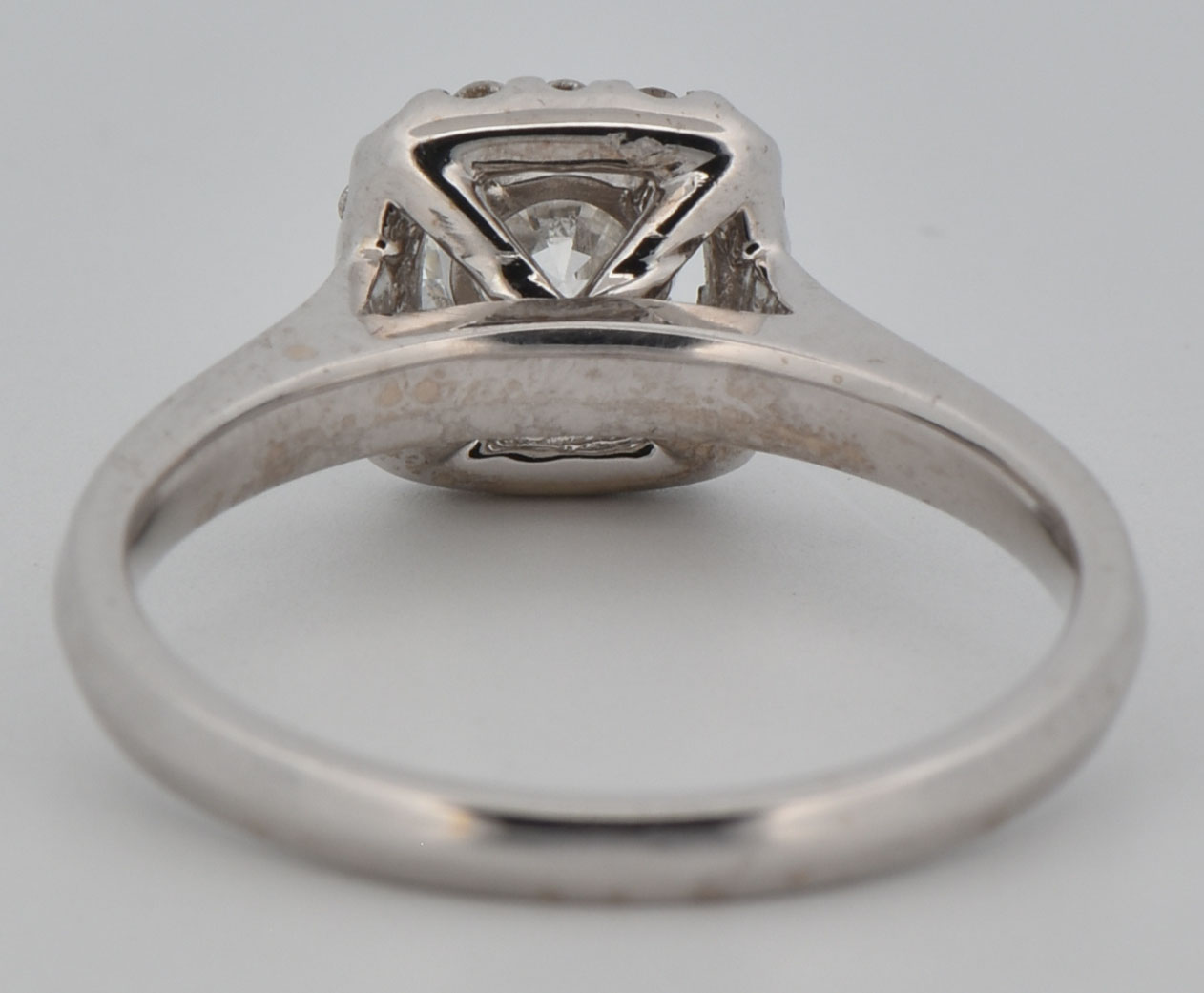 14K White Gold Estate Diamond Ring with an Approximate .60 Carat Round Cut Center Diamond, I1 Clarity, H-I Color and Approximately .15 Carat Total Weight. Finger Size 7. 2.4 dwt.