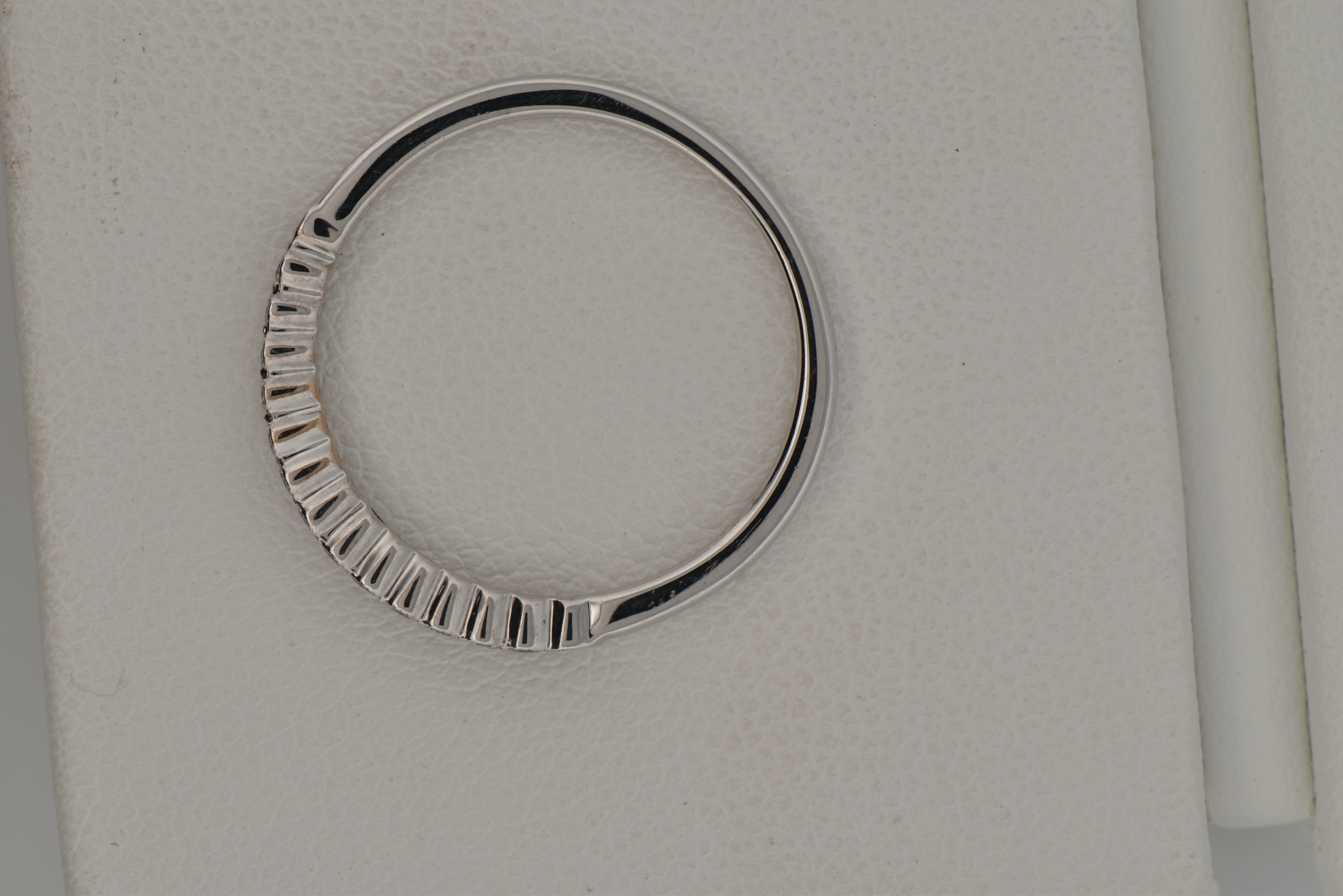 18K White Gold Estate Diamond Band with Approximately .15 Carat Total Weight in Round Cut Diamonds, SI Clarity, H-I Color. Finger Size 6.5, 1.2 dwt.