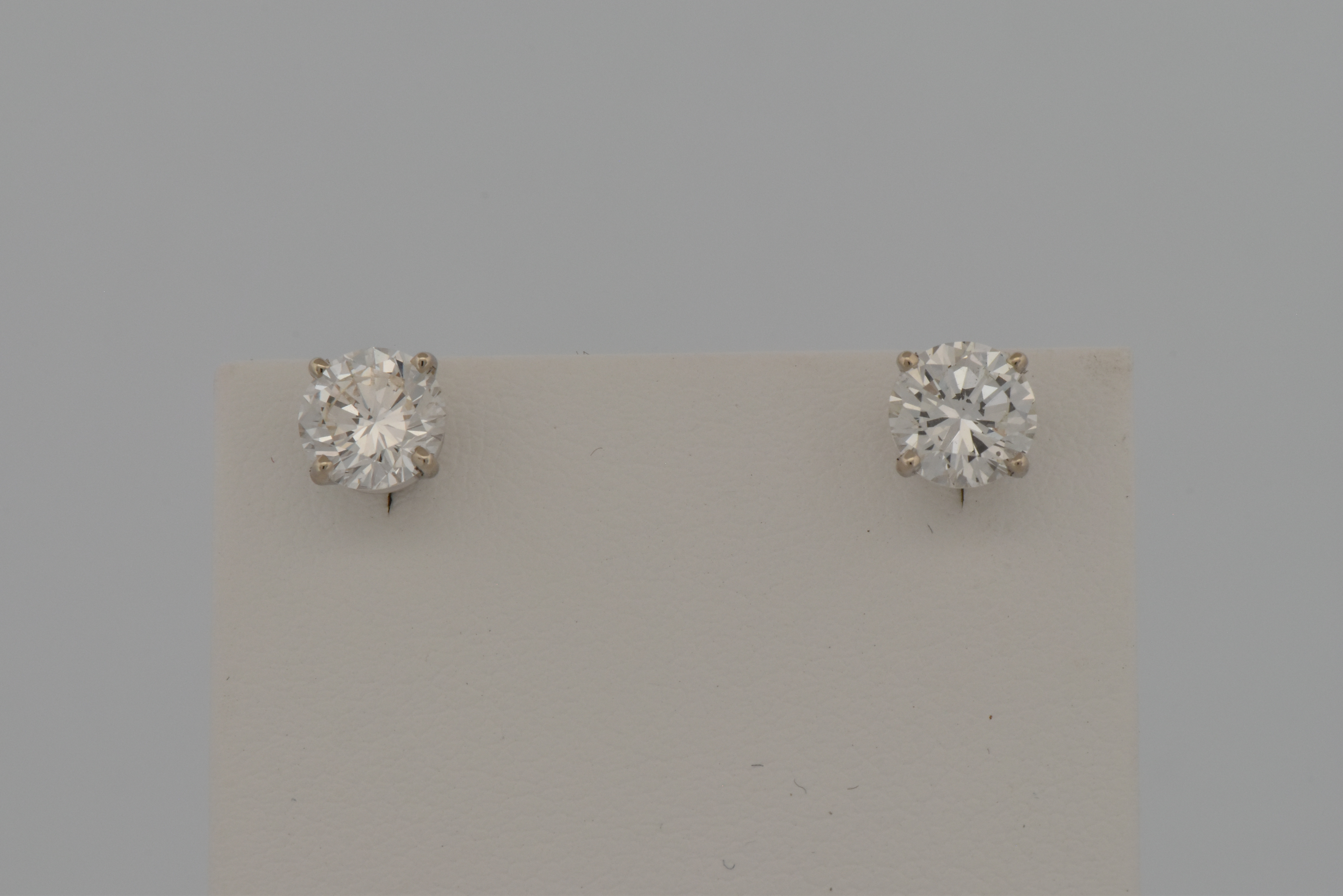 14K White Gold Diamond Earrings with a 1.06 Carat Round Brilliant, SI1 Clarity, I Color GIA #2235334485 and a 1.06 Carat Round Brilliant, SI2 Clarity, I Color GIA #6234334538