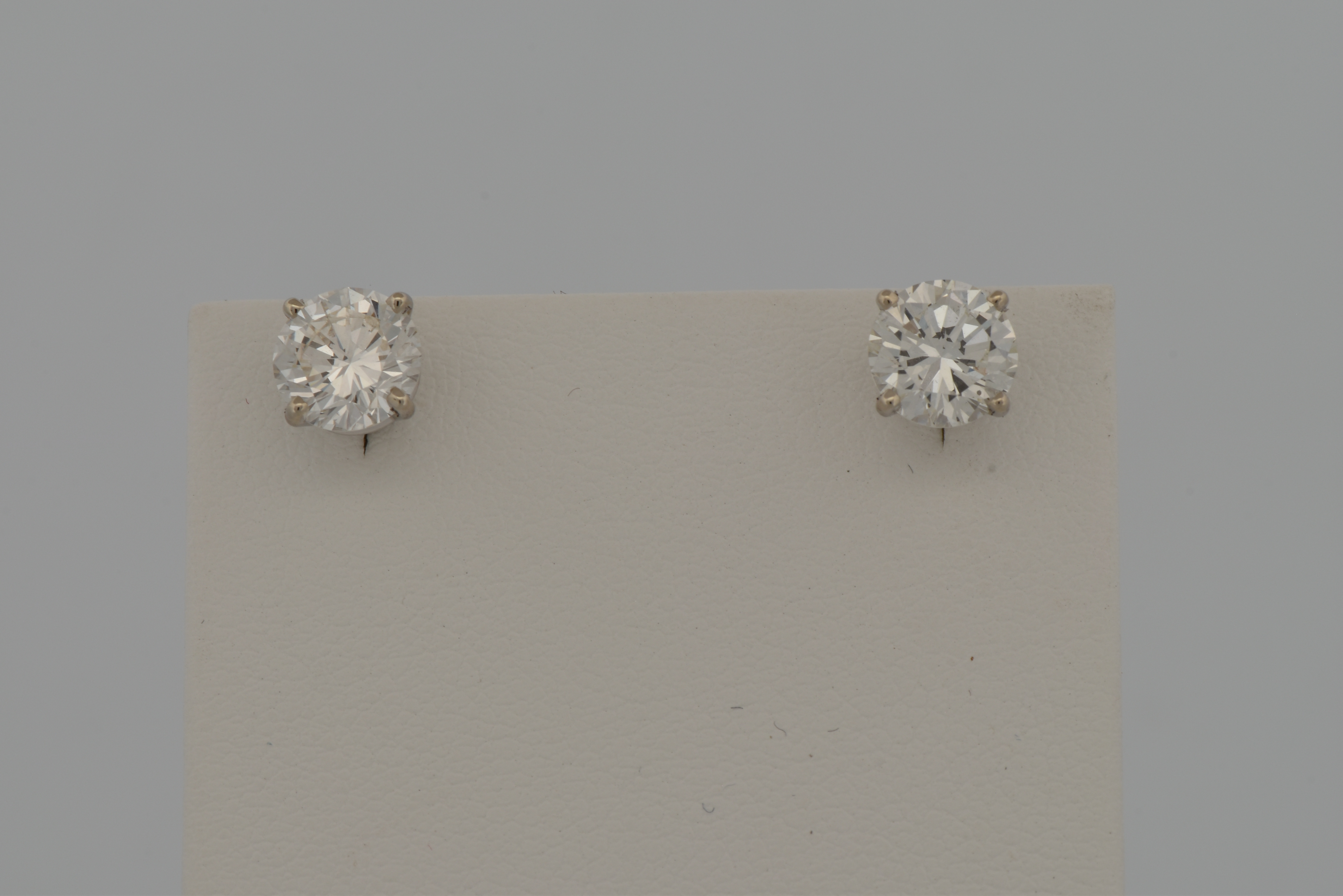 14K White Gold Diamond Earrings with a 1.06 Carat Round Brilliant, SI1 Clarity, I Color GIA #2235334485 and a 1.06 Carat Round Brilliant, SI2 Clarity, I Color GIA #6234334538