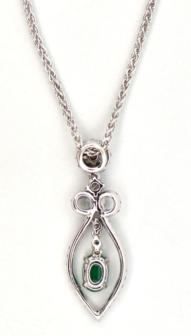14K White Gold Estate Emerald and Diamond Necklace with a 6x4mm Oval Emerald and Approximately .50 Carat Total Weight in Round Cut Diamonds, SI2 Clarity, I-J Color on an 18 Inch Wheat Chain. 4.1 dwt.