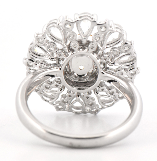 18K White Gold Diamond Ring with a 1.43 Carat Oval Fancy Yellow Diamond and .80 Carat Total Weight in Round Yellow and White Diamonds and 1.40 Carat Total Weight in Pears
